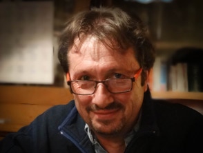 Photograph of Jonathan sitting at a table